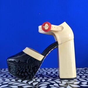 Clarks Two-Tone Patent Platform Heels in Black and Cream with Red Button Accent